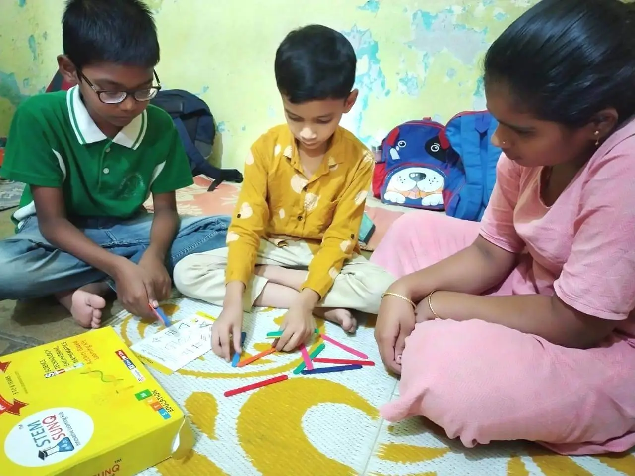 parent and children engaging in stem activities workshop