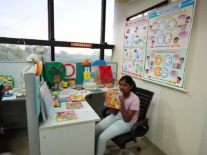 a-student-girl-sitting-in-stem-math-lab-and-holding-math-lab-equipment
